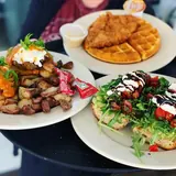 Chicken and waffles and brunch plates at Cultivate Community Table
