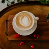 Latte with latte art at Grounded Coffee Bar