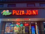 Rich’s Pizza Joint neon sign and storefront