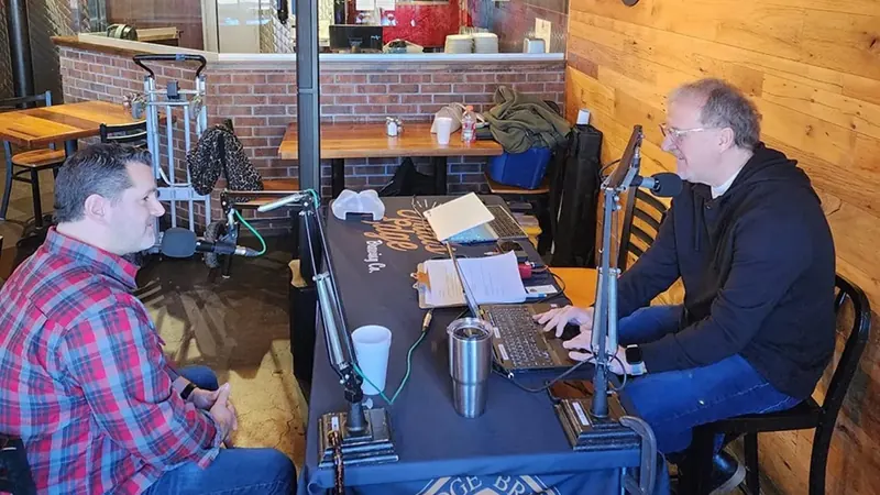 1340 AM WJOL host interviewing a guest during a live broadcast